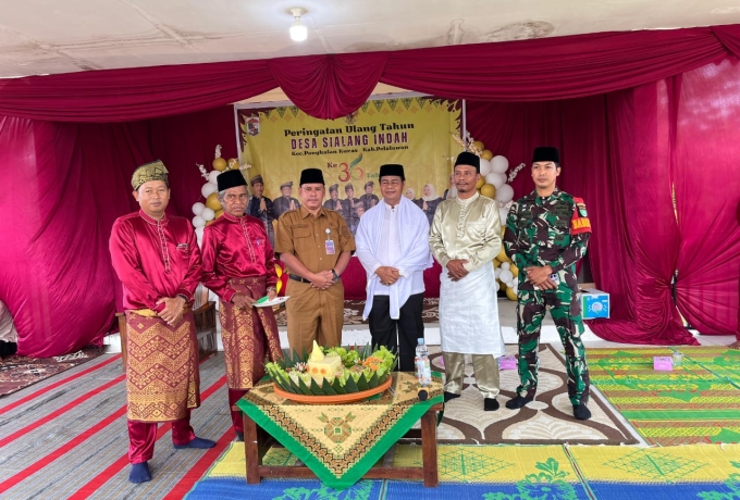 Babinsa Serda Syamsul Bastian Hadiri Ulang Tahun Desa Sialang Indah