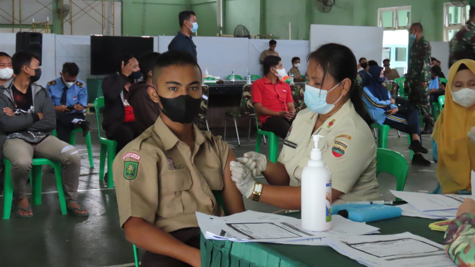 Kodim 0313/KPR Gelar Vaksinasi Covid 19 Bagi Pelajar dan Mahasiswa