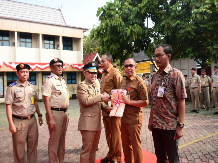 Pj Bupati Kampar Hadiri Upacara Sekaligus Penyerahan Sertifikat Tanah Dalam Rangka HANTARU Ke 64