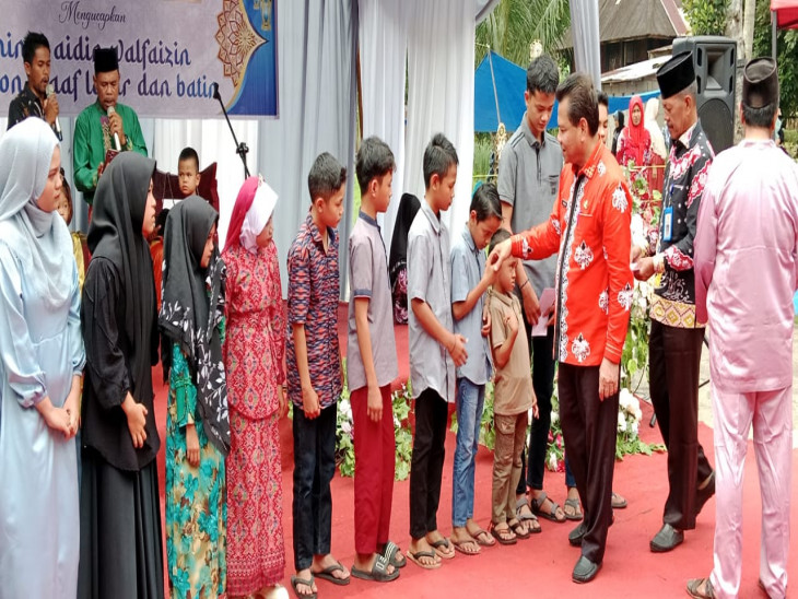 Pj Bupati Kampar Buka Serangkaian Acara di Kuok, Bakela, Santunan Anak Yatim, MTQ, dan Pacu Tongkang