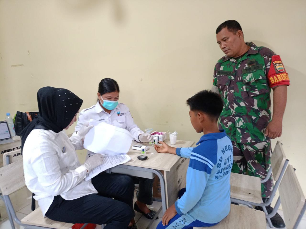 Babinsa Koramil 16/Tapung Dampingi Lounching Program Cek Kesehatan Gratis Bagi Pelajar 