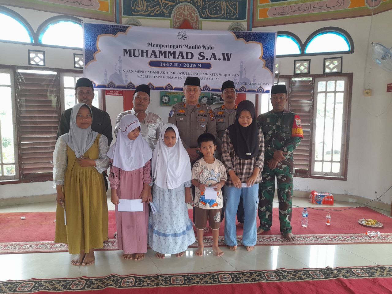 Babinsa Sertu Ilham Khairi Bersama Polsek Pangkalan Kuras Hadiri Perayaan Maulid Nabi Muhammad SAW
