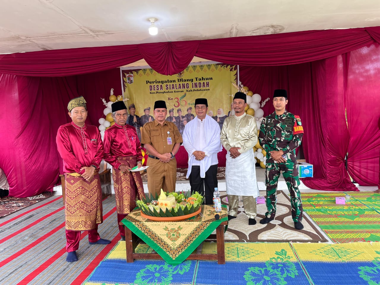 Babinsa Serda Syamsul Bastian Hadiri Ulang Tahun Desa Sialang Indah